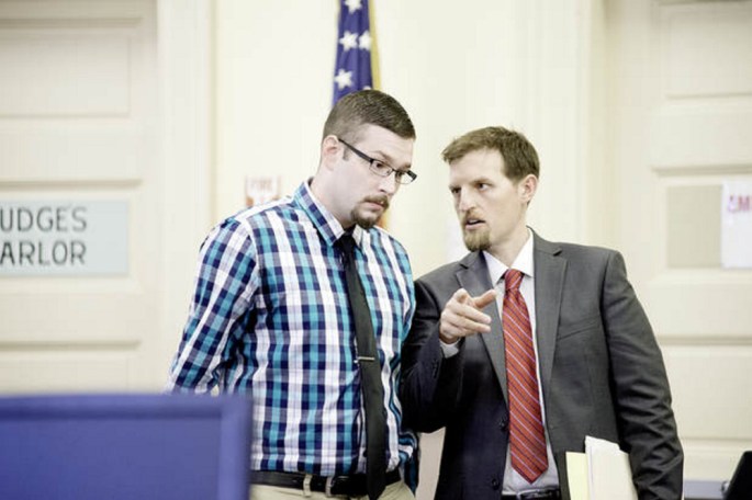 Timothy Danforth, left, talks with his co-counsel, Jeffrey Wilson, prior to the start of Danforth's murder trial in Franklin County Superior Court on Monday.