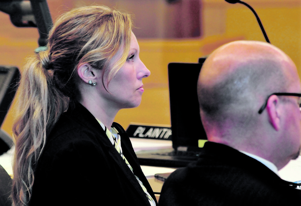 State police Detective Jennifer Fiske sits next to Assistant Attorney General Donald Macomber during the Robert Burton murder trial this week at Penobscot Superior Court in Bangor. Fiske took the stand on Friday.