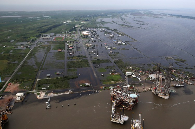Flooding from Tropical Storm Harvey surrounds buildings in Sabine Pass, Texas, next to the Gulf of Mexico.