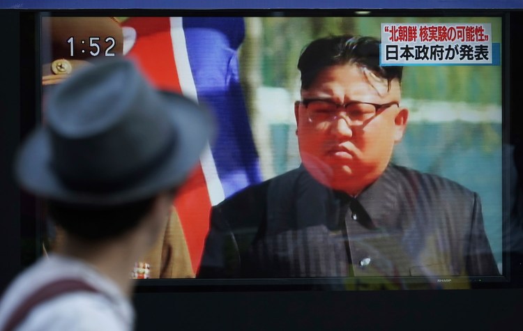 A man in Tokyo watches a news program on a public screen showing North Korean leader Kim Jong Un on Sept. 3, the day of a nuclear test by North Korea. Early Friday, North Korea launched another missile over Japan.