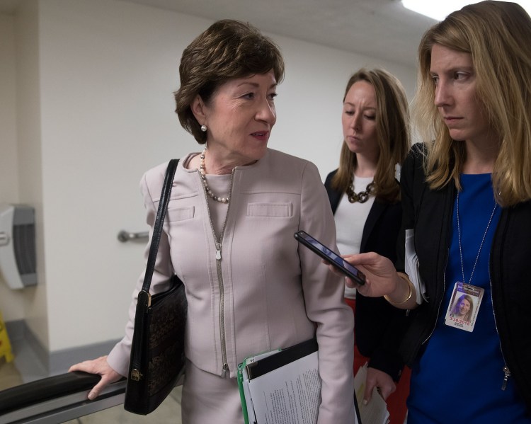 Sen. Susan Collins, R-Maine, speaks with a reporter as she arrives for a vote at the Capitol on Tuesday. In a Senate floor speech, she beseeched her colleagues to work toward a bipartisan compromise on repairing the Affordable Care Act.