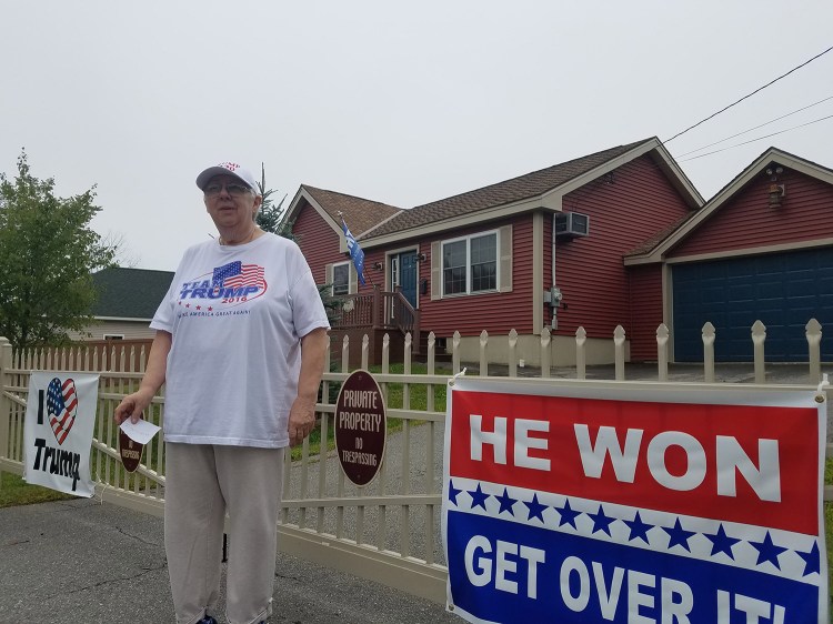 Susan Reitman of Seavey Lane in Rockland has said she won't take down the signs on her property and won't pay a fine for allegedly violating a town ordinance regarding the size and number of signs on private property.