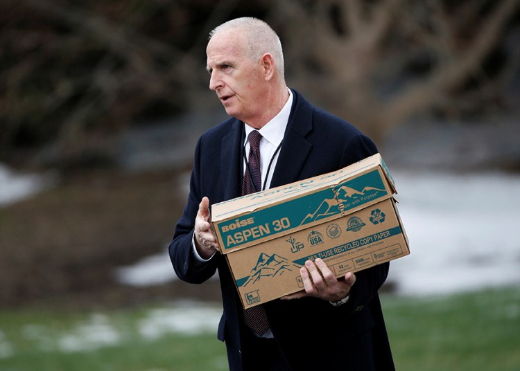 Keith Schiller, deputy assistant to the president and director of Oval Office operations, carries a box to Marine One at the White House on March 17, 2017.  