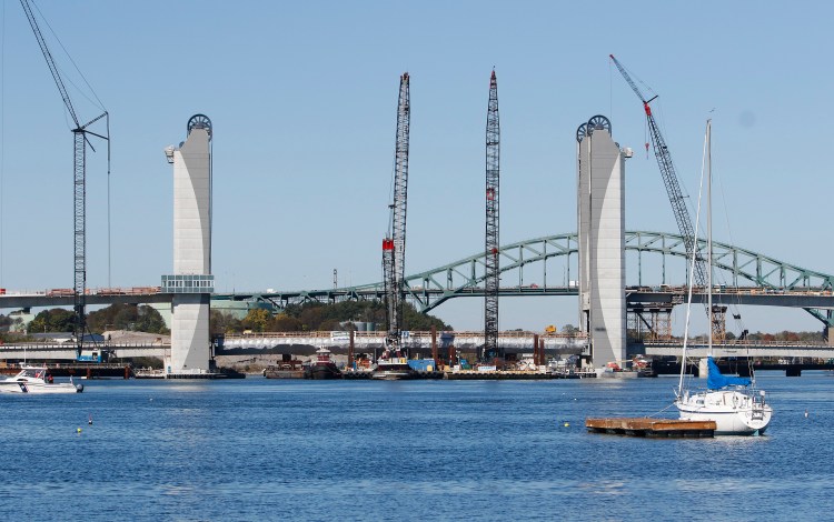 A 4 million-pound structural steel span the length of a football field was floated over the Piscataqua River on two barges Tuesday and maneuvered into place at the center of the new bridge that connects Kittery with Portsmouth, N.H.
