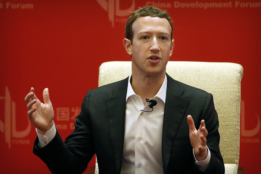 Facebook CEO Mark Zuckerberg speaks during a panel discussion in Beijing.
