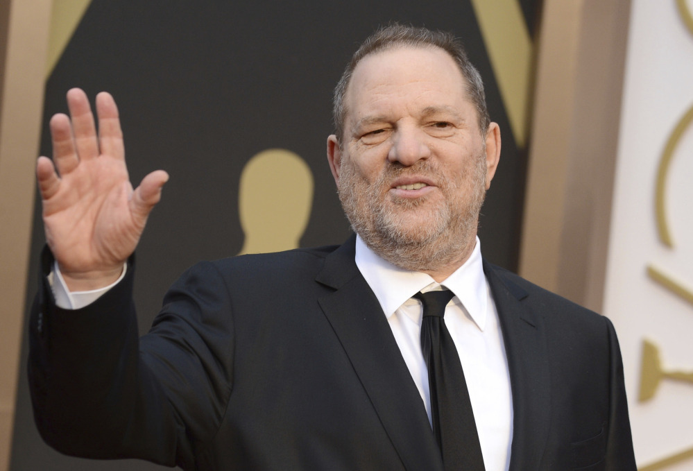 Harvey Weinstein, seen at the Oscars in 2014, was fired by his own company over allegations of sexual harassment.