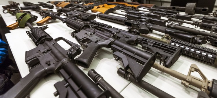 A variety of military-style semi-automatic rifles obtained during a buy back program are displayed at Los Angeles police headquarters. While recent American mass killers might not seem to follow any pattern, their access to high-powered weaponry remains a constant.