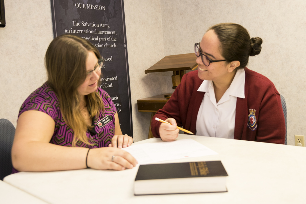 Salvation Army caseworker Amber White, left, meets with Lt. Anagelys Cruz on Friday. The two discussed arrangements for Cruz's upcoming trip to Puerto Rico. Cruz, who was born in Puerto Rico, plans to provide assistance to residents affected by the devastating hurricane.