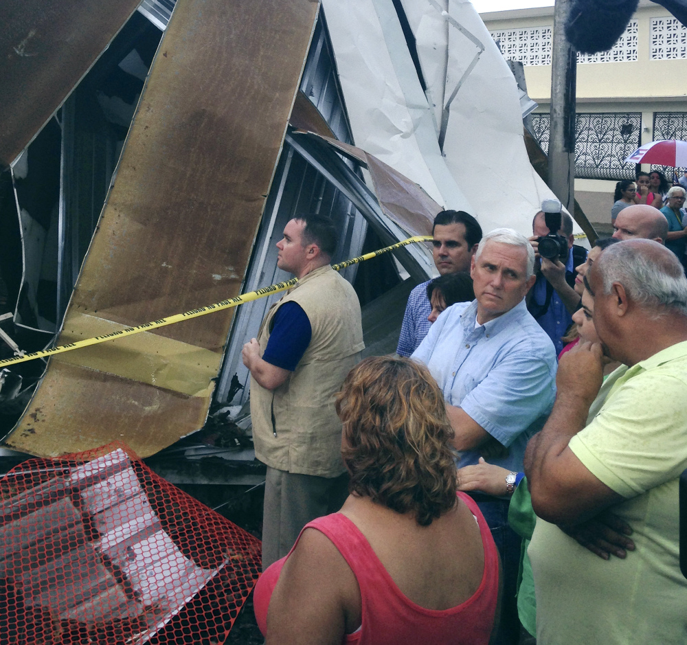 Vice President Mike Pence visits San Juan, Puerto Rico, on Friday. Hurricane Maria wiped out power and left the island's 3.4 million people short of food and supplies.