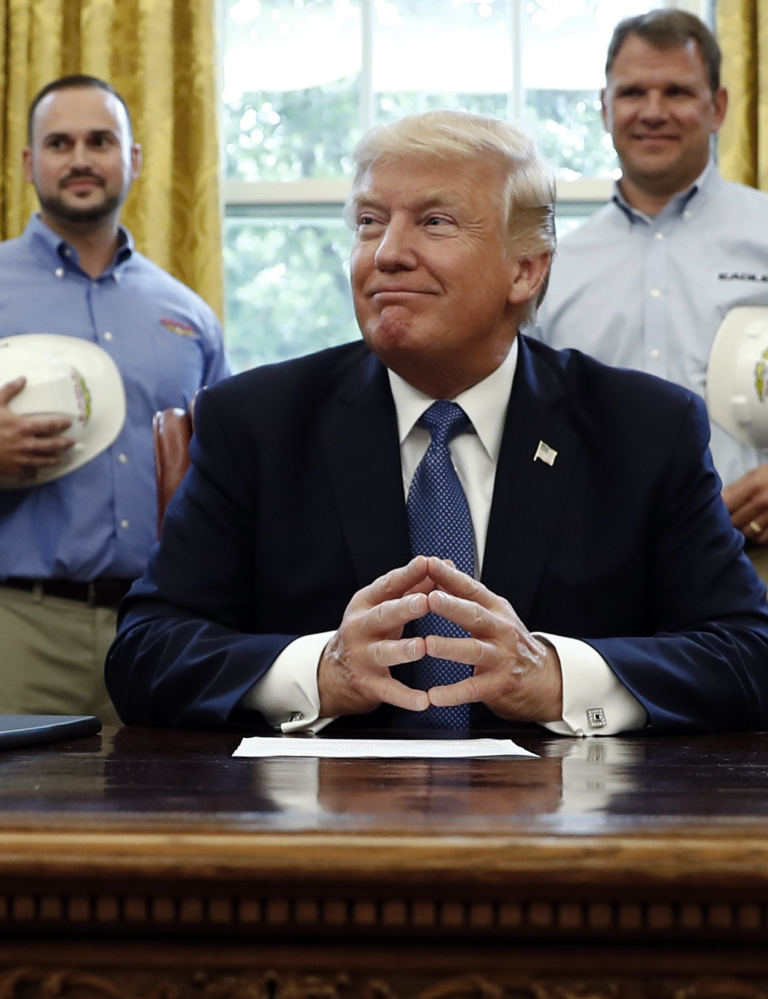 President Trump pauses before signing a National Manufacturing Day Proclamation on Friday.