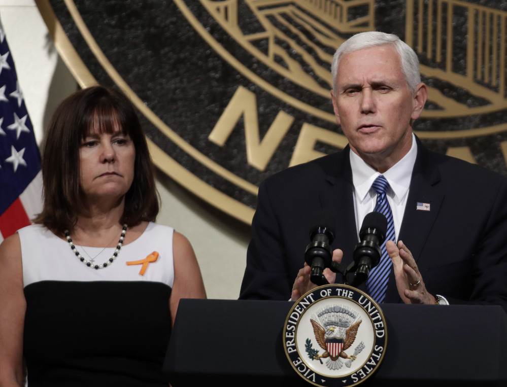 Vice President Mike Pence, accompanied by his wife, Karen, speaks in Las Vegas on Saturday following a unity prayer walk honoring the victims of last weekend's massacre.