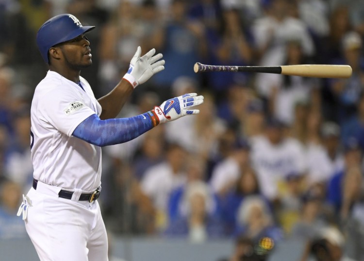 L.A.'s Yasiel Puig celebrates after a single against Arizona during the fourth inning of Game 2 on Saturday night.