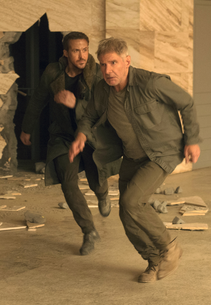 Ryan Gosling, left, and Harrison Ford appear in a scene from "Blade Runner 2049" in this image released by Warner Bros. Pictures.