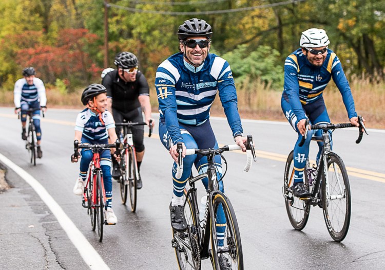 Patrick Dempsey rides down Riverside Drive in Auburn on the first leg of his Dempsey Challenge bike ride Sunday.