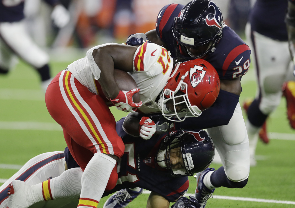 Chiefs running back Kareem Hunt is hit by Houston free safety Andre Hal. Hunt continued his stellar rookie season with 107 yards on 29 carries in Kansas City's 42-34 victory.
