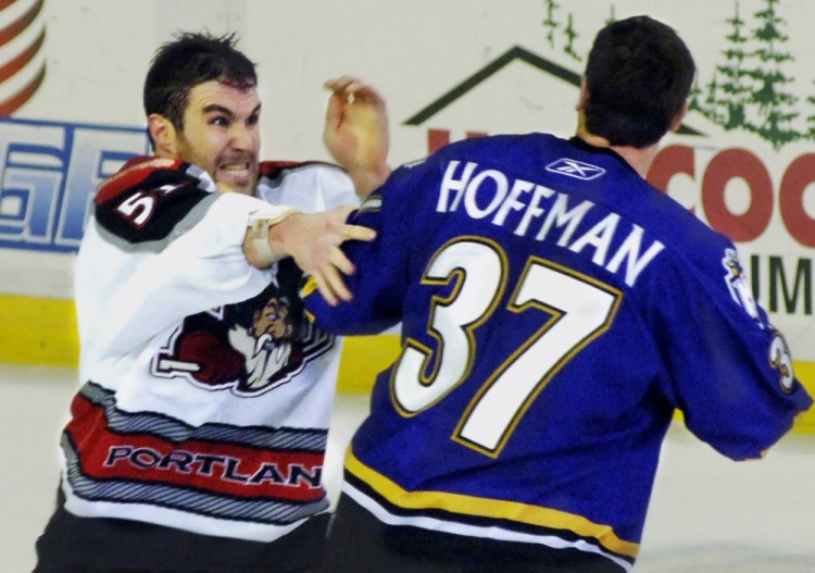 Trevor Gillies, left, and Mike Hoffman became Portland Pirates teammates shortly after this fight in 2006. Gillies, still an active player, is sad to see fighting being phased out.