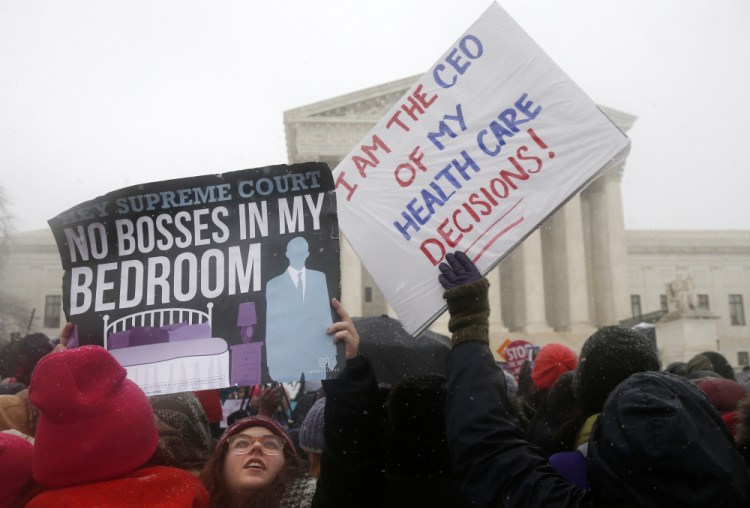 Demonstrators rally in Washington in 2014 in support of the Affordable Care Act requirement that employers cover contraception in their health insurance plans. Under a new federal rule, any "sincerely held" religious or moral objection to the mandate is now valid grounds for an employer to end birth control coverage.