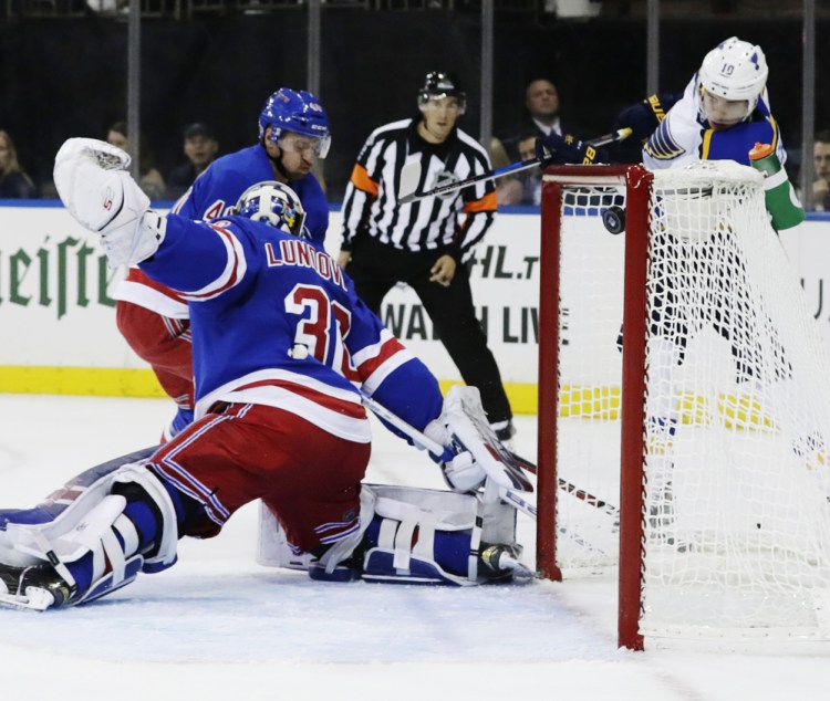 Brayden Schenn of the Blues shoots the puck past Rangers goalie Henrik Lundqvist during the first period of Tuesday's game in New York. St. Louis won 3-1 to go to 4-0.