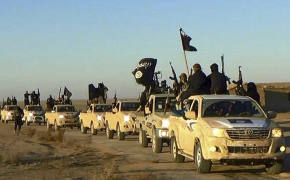 An undated website photo shows Islamic State militants on a convoy in Raqqa, Syria. In the past three weeks, up to 15 militants, including a senior leader, have surrendered in Raqqa.