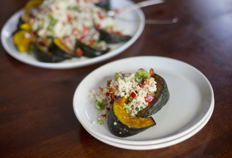 Cold-Climate Rice Salad is served on a bed of roasted squash.