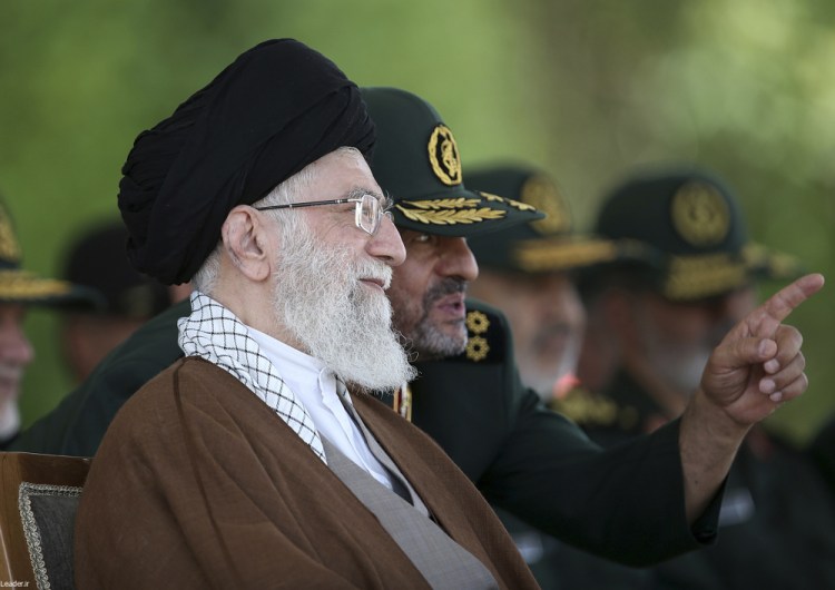 Supreme Leader Ayatollah Ali Khamenei listens to Revolutionary Guard commander Mohammad Ali Jafari during a graduation ceremony of a group of the guard's officers in Tehran, Iran, in 2015. Iran's paramilitary Revolutionary Guard faces new sanctions from U.S. President Trump.