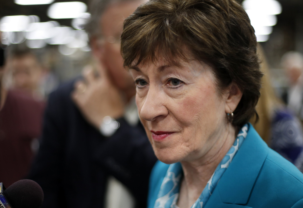 Sen. Susan Collins, R-Maine, takes a question from a reporter while attending an event in Lewiston last August. 