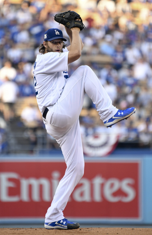 Dodgers starting pitcher Clayton Kershaw winds up during the first inning.