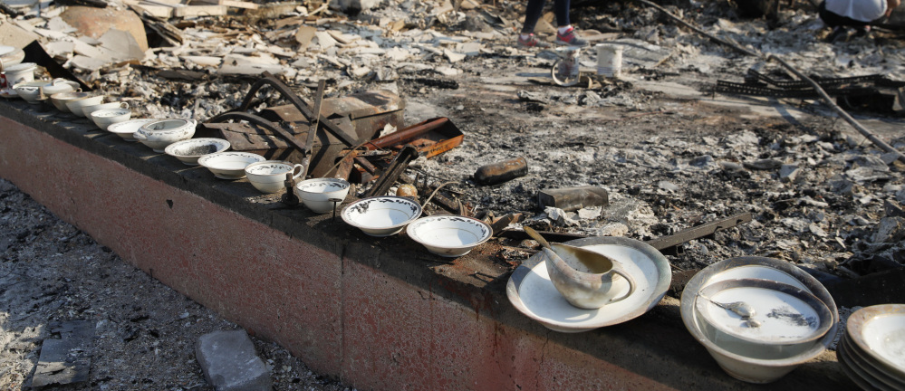 A set of salvaged china lines the foundation of a burned home in Santa Rosa, Calif. Some agencies want the cost of fighting wildfires to be covered by the federal Disaster Relief Fund.