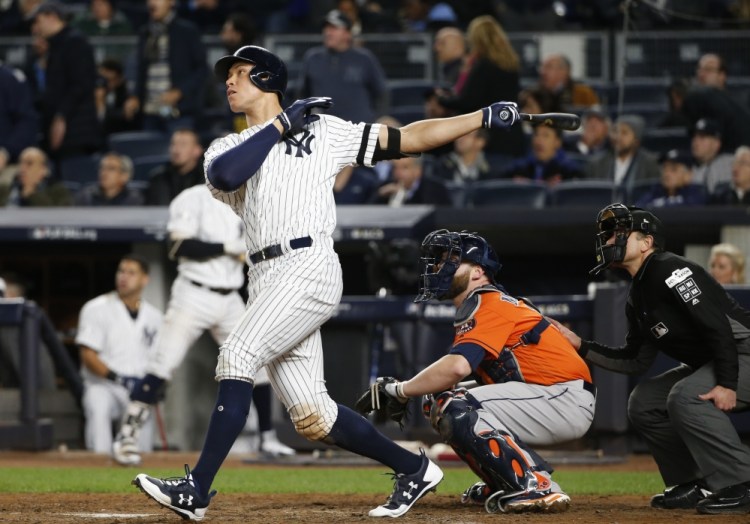 Aaron Judge hits a home run in the seventh inning in the Yankees' 6-4 win over Houston in Game 4 of the ALCS. The Yankees evened the series at 2-2 with the win.