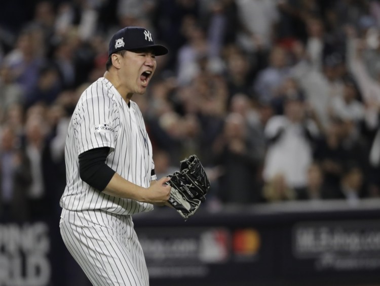 Masahiro Tanaka reacts after striking out Houston's Josh Reddick to end the fifth inning Wednesday night in New York. Tanaka threw seven scoreless innings in New York's 5-0 win.