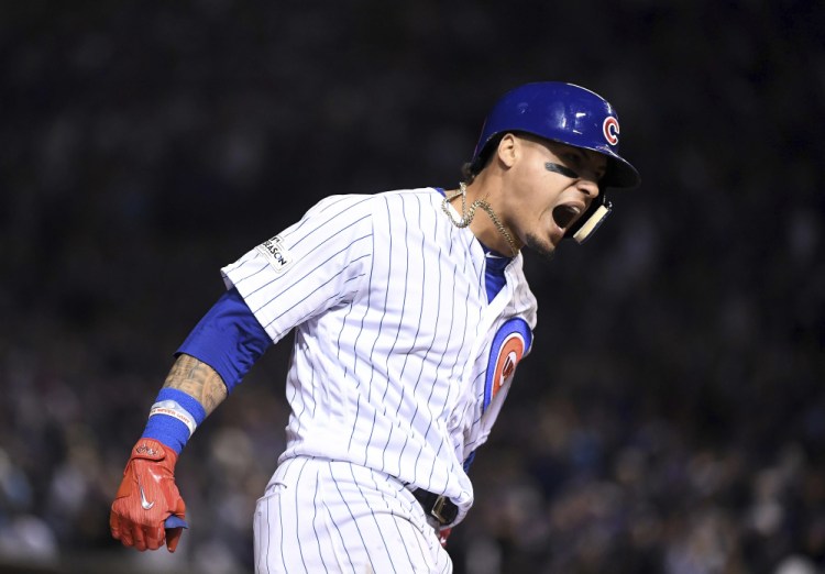 Javier Baez of the Cubs runs the bases after a fifth-inning home run against the Los Angeles Dodgers Wednesday night in Chicago.