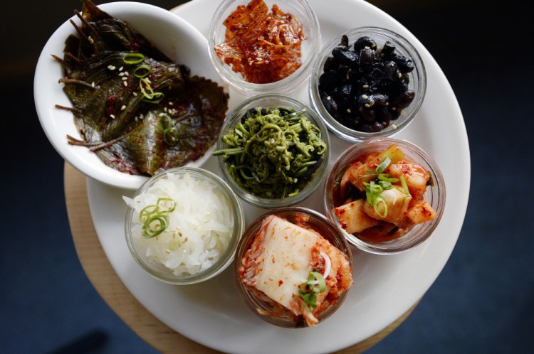 Banchan consists of three small side dishes and accompaniments.