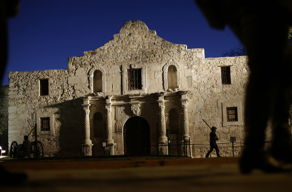 Dan Phillips, a member of the San Antonio Living History Association, patrols the Alamo in 2013.
Associated Press/Eric Gay
