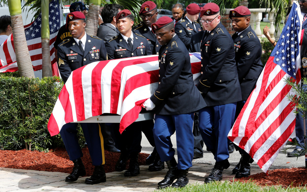 An honor guard carries the coffin of Army Sgt. La David Johnson at a graveside service in Hollywood, Fla., on Saturday. 