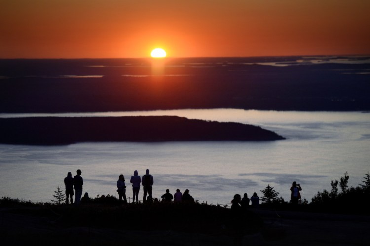 The sunrise atop Cadillac Mountain draws multitudes every year to Acadia National Park on Maine's coast. But proposed peak-season price hikes to several national parks could make the visits much less affordable. The public comment period on the National Park Service proposal has been extended until Dec. 22.