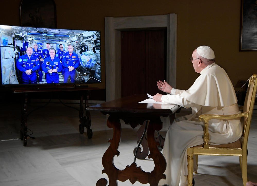 Pope Francis speaks to the International Space Station crew from the Vatican on Thursday.  One American told him seeing Earth's beauty from there inevitably touches the soul.