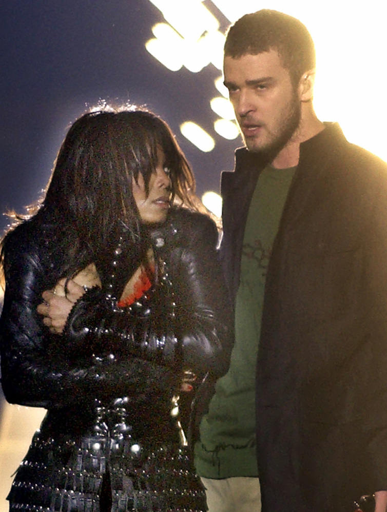 Singer Janet Jackson covers her breast as Justin Timberlake holds part of her costume after her outfit came undone on Feb. 1, 2004.