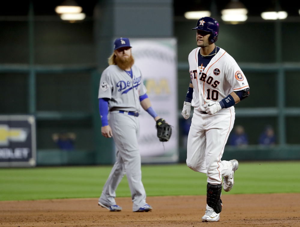 Houston's Yuli Gurriel rounds the bases after hitting a home run during the second inning of Game 3 on Friday night in Houston.