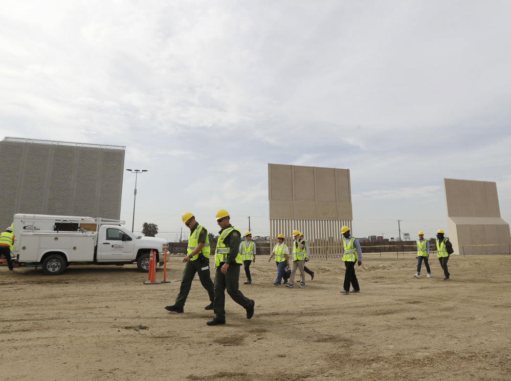 Border wall prototypes are displayed at a construction site in San Diego near the border with Tijuana, Mexico, last week. Eight prototypes have been completed.
