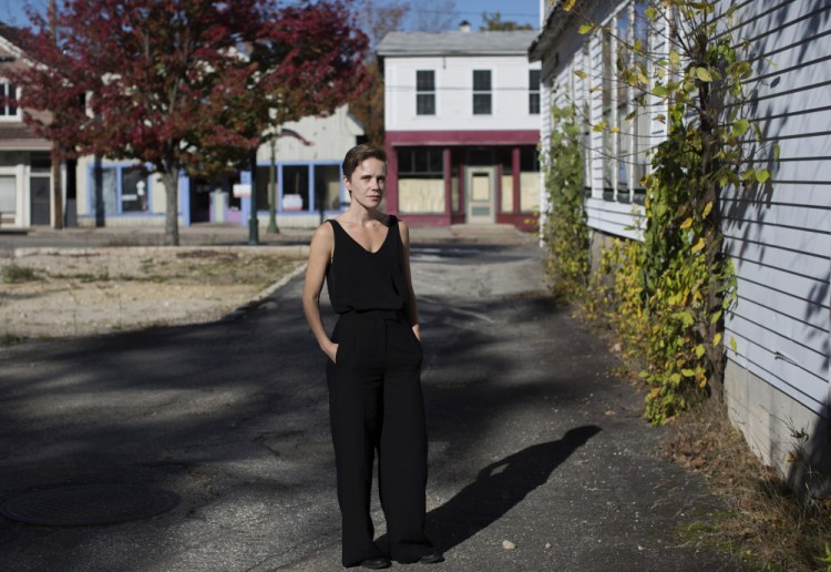Sarah Perry, 35, on Main Street in Bridgton. Perry pored through scores of police reports and interviewed dozens of family members and friends over six years to better understand a horrific night in 1994 when she heard her mother's murder beyond a closed door.