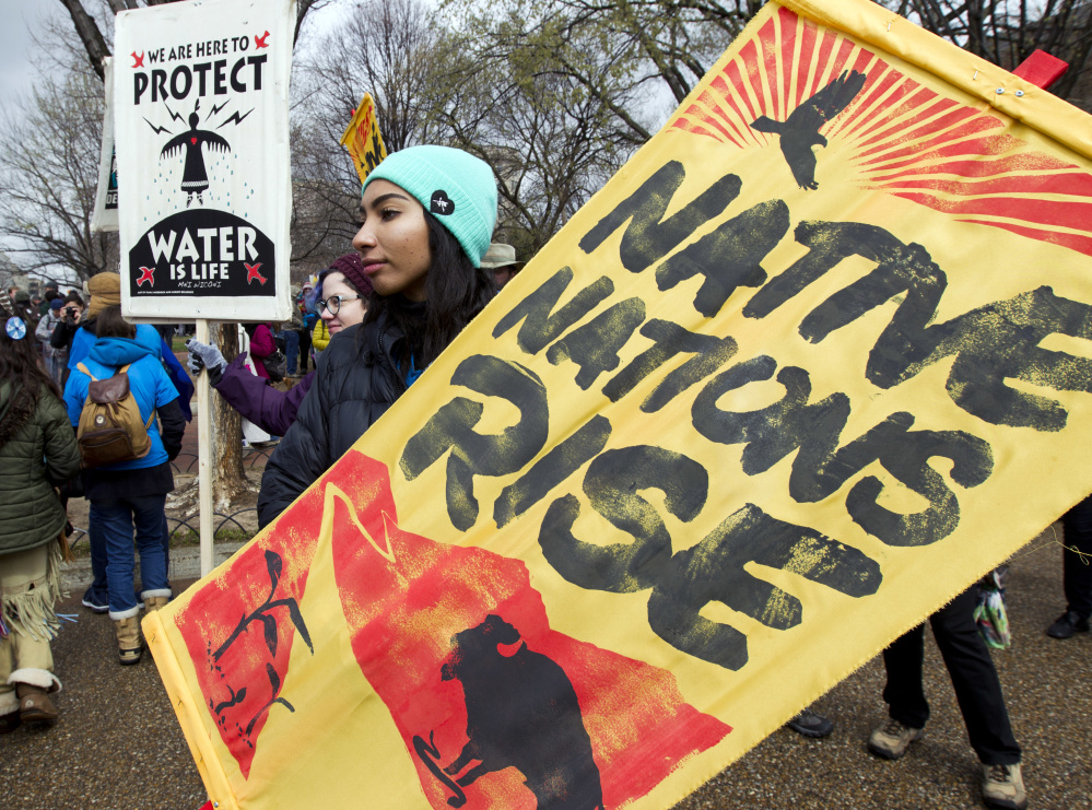 Demonstrators rally outside the White House in March against construction of the disputed Dakota Access pipeline. Some members of Congress think oil pipeline protesters should be labeled domestic terrorists.