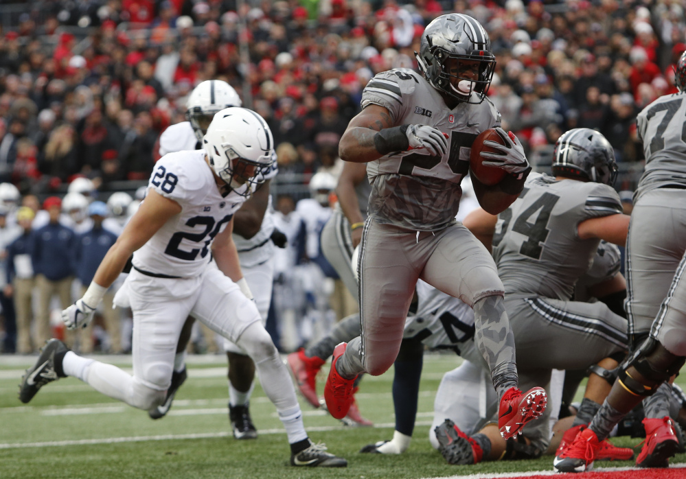 Ohio State running back Mike Weber, right, scores a touchdown against Penn State during the first half of an NCAA college football game Saturday, Oct. 28, 2017, in Columbus, Ohio. ()