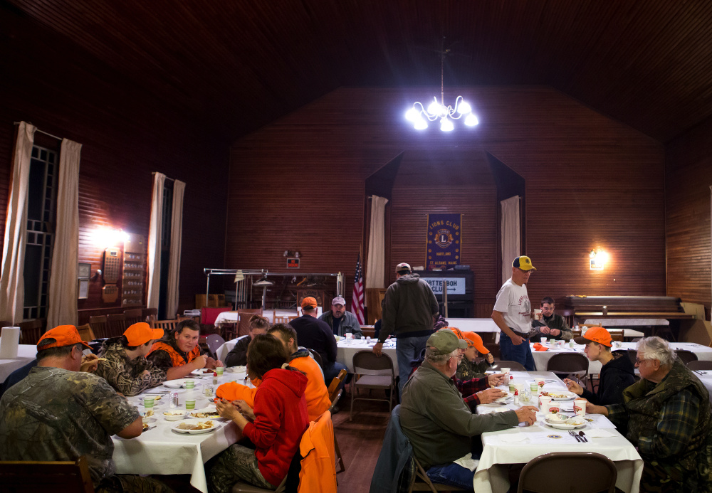 Hunters eat together Saturday before heading to the woods during the hunter's breakfast hosted by the Hartland-St. Albans Lions Club at the Chatterbox Club building in St. Albans. It was the first day of firearms deer season.