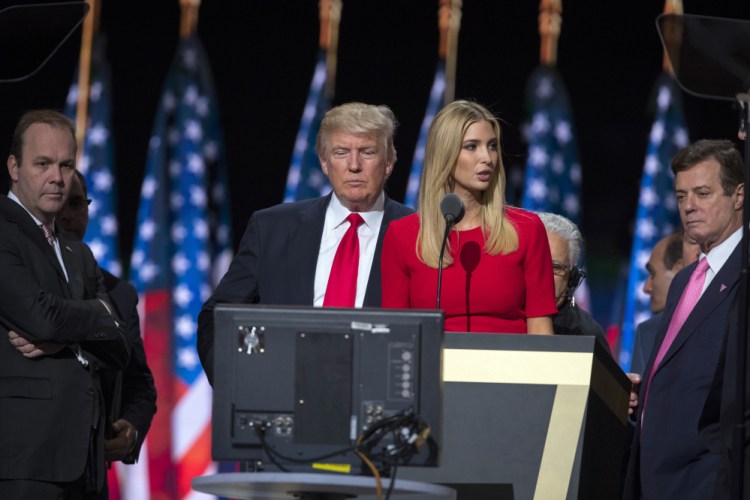 Then-Trump campaign manager Paul Manafort, right, watches with Donald Trump and Manafort's chief deputy Rick Gates, left, as Ivanka Trump rehearses for her RNC speech in Cleveland. Manafort and Gates have been indicted on charges of conspiracy against the United States and other counts.