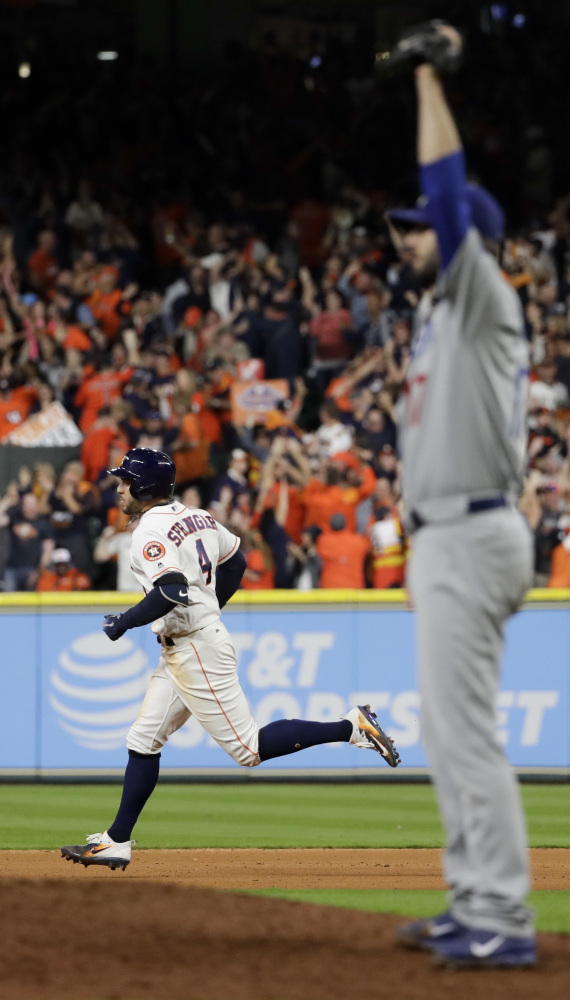 Houston's George Springer circles the bases after hitting a tying home run off Dodgers reliever Brandon Morrow in Game 5 of the World Series on Sunday night. Morrow did not allow a homer in the regular season but has given up three in the playoffs.