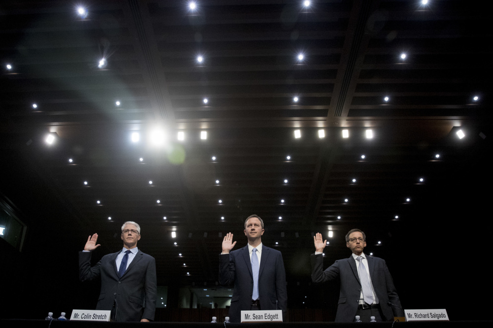 From left, Facebook's General Counsel Colin Stretch, Twitter's Acting General Counsel Sean Edgett, and Google's Law Enforcement and Information Security Director Richard Salgado, are sworn in for a hearing before the Senate subcommittee on crime and terrorism on Capitol Hill in Washington on Tuesday.