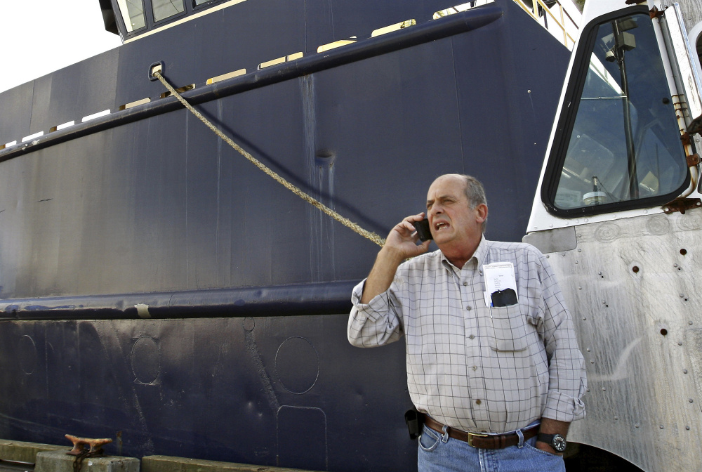 Carlos Rafael is shown near his herring boat F/V Voyager in New Bedford, Mass., in 2014.
