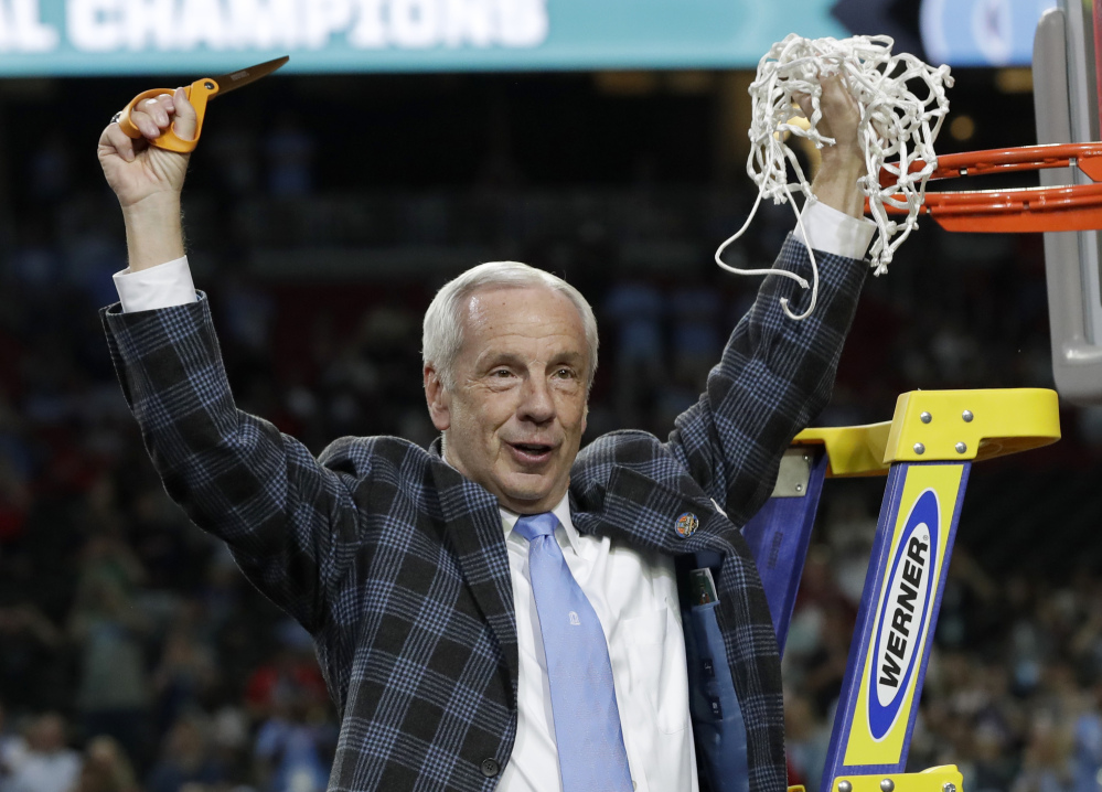 North Carolina Coach Roy Williams did some net-cutting after the Tar Heels defeated Gonzaga to win the NCAA men's basketball title last season. The Tar Heels are projected to finish second in the Atlantic Coast Conference.