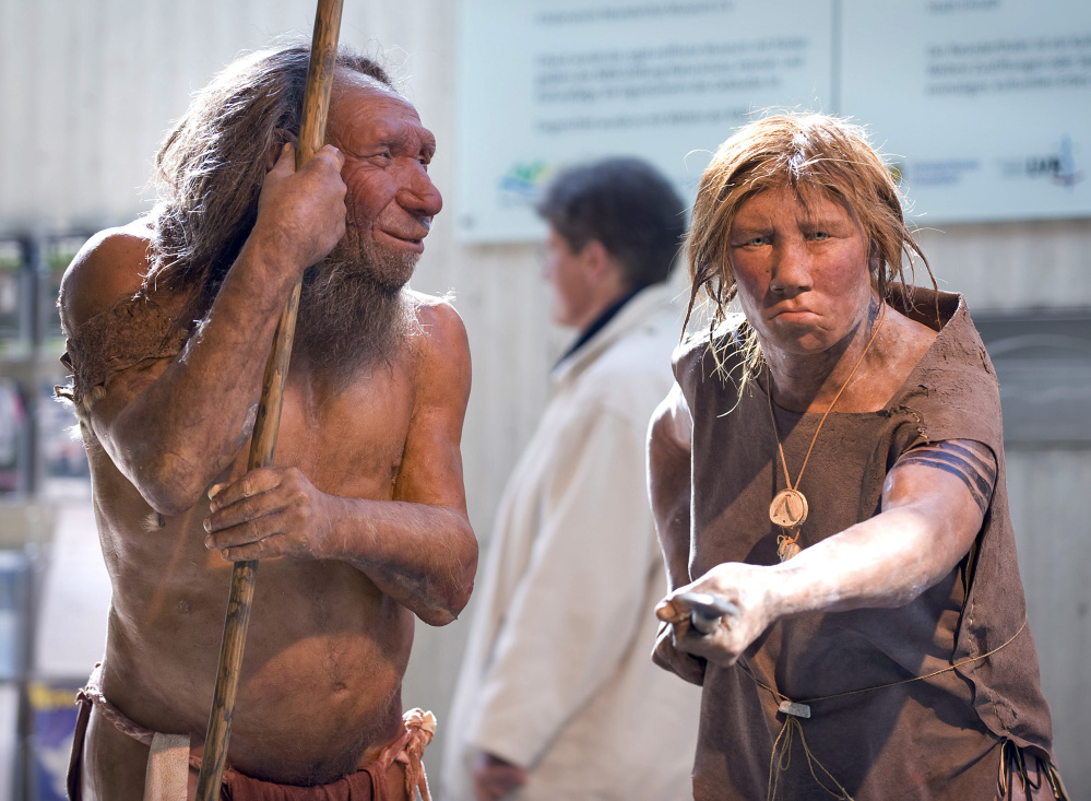 Prehistoric Neanderthal man "N" is visited for the first time by Wilma, another reconstruction of a homo neanderthalensis, right, at the Neanderthal museum in Mettmann, Germany, in this photo from 2009.