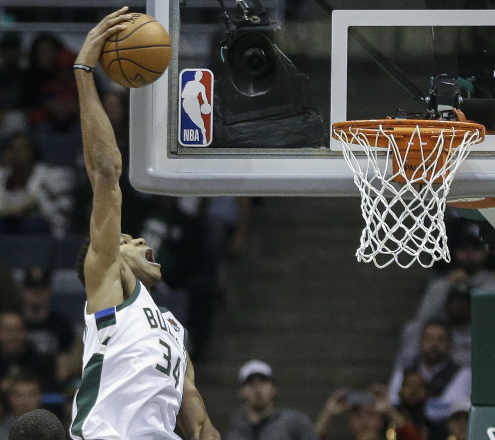 Giannis Antetokounmpo, who scored 28 points Tuesday night for the Milwaukee Bucks, goes up for a dunk during the first half of a 110-91 loss at home to the Oklahoma City Thunder.